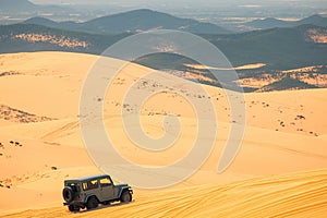 Adventure in Vietnam Jeep car on Mui Ne sand dunes