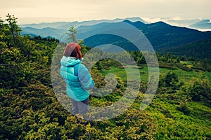 Adventurer female on the mountain slope