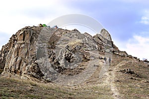 Adventurers with tents on the top of the mountain