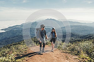 Adventures Couple trail hiking in the forest photo