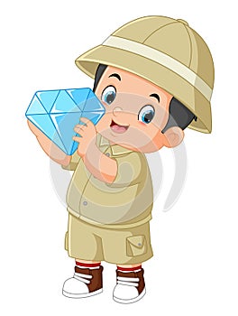 an adventurous boy is delighted to find a large diamond