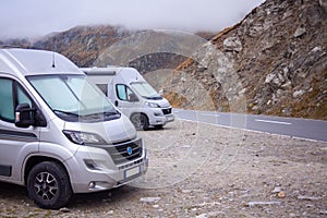 Adventurous camper cars embarking on a scenic journey through the mountains
