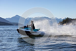 Adventurous Caucasian Woman on Sea-Doo riding in the Ocean.