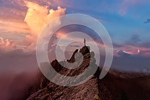 Adventurous Girl on top of a Mountain Peak