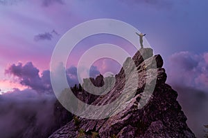 Adventurous Girl on top of a Mountain Peak