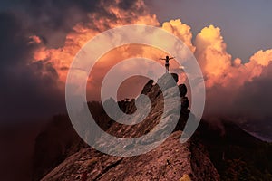 Adventurous Girl on top of a Mountain Peak