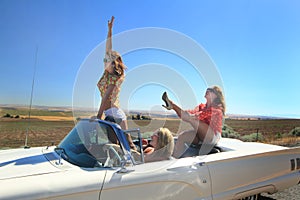 Adventurous Girls in Convertible