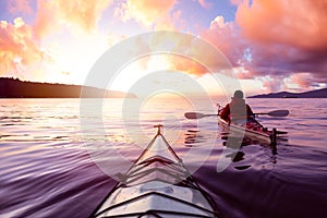 Adventurous Man Sea Kayaking in the Ocean