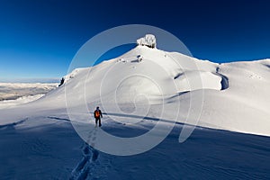 Adventurous man Snowshoeing on the snow