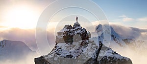 Adventurous Man Standing on top of Mountain Cliff. Dramatic Extreme Adventure Composite