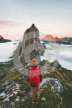 Adventurous woman enjoying sunset Segla mountain