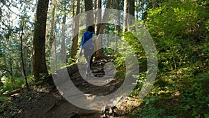 Adventurous Woman Hiker on a hiking trail at top of Canadian Mountain Landscape. St. Mark's Summit