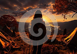 The Adventurous Woman Leading a Camping Expedition at Sunset