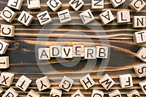 Adverb - word from wooden blocks with letters