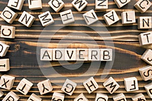 Adverb - word from wooden blocks with letters