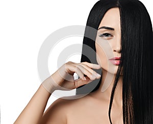 Advertisement concepclose up of woman brunette with half of her face screened with her hair slides her finger along the cheekbone photo