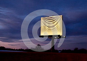 advertising banner billboard by the road is covered with a white cloth. a