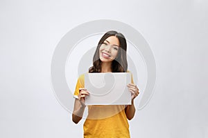 Advertising banner sign - woman excited pointing looking empty blank billboard paper sign board. Young business woman