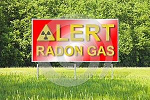 Advertising billboard in a rural scene with Alert Radon Gas text