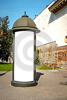 Advertising column mock up. Blank billboard outdoors, outdoor advertising, public information board in the european city