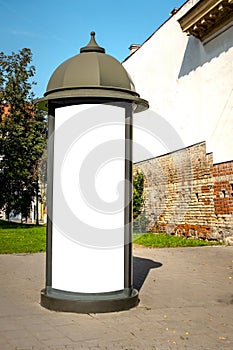 Advertising column mock up. Blank billboard outdoors, outdoor advertising, public information board in the european city