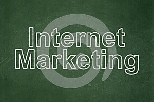 Advertising concept: Internet Marketing on chalkboard background