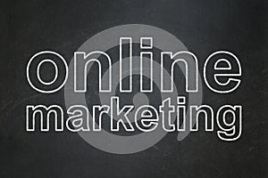 Advertising concept: Online Marketing on chalkboard background