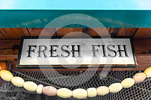 Advertising sign fresh fish fishing net entrance fish market restaurant