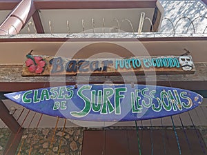 Advertising sign on surfboard surf board in Puerto Escondido Mexico photo