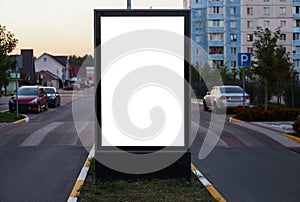 Advertising space under the poster. Lightposter citylight mockup small billboard in the city near the roadway. white space for
