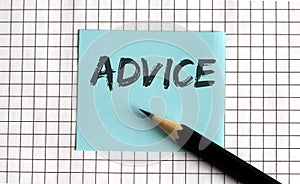 ADVICE   the phrase is written on colored stickers  on a notepad background. Business concept