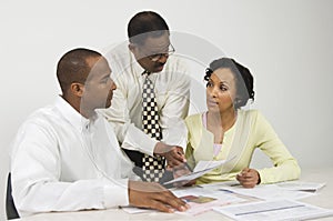 Advisor Explaining Financial Plans To Couple