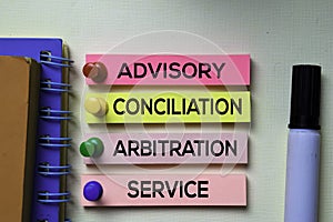 Advisory Conciliation and Arbitation Service - ACAS text on sticky notes isolated on office desk