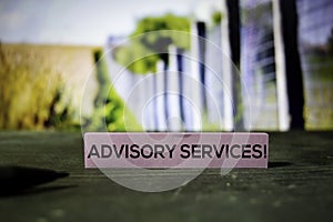 Advisory Services! on the sticky notes with bokeh background