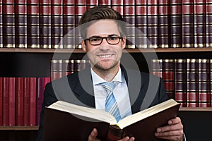 Advocate Reading Book At Courtroom photo