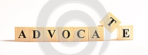 ADVOCATE word made of wooden blocks on a light background. Legal concept photo