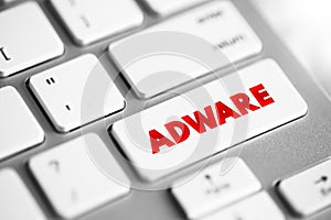 Adware - unwanted software designed to throw advertisements up on your screen, text concept button on keyboard