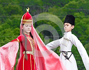 Adyghe girl and boy in national costume on the Circassian ethnic festival in Adygeya