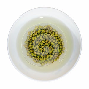 Adzuki beans in a bowl isolated over white