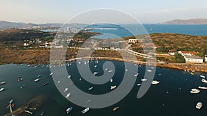 Aegean sea bay coast line peninsula with yachts, sailing boats and catamarans.