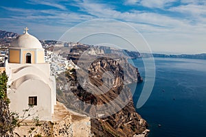 Aegean sea and the Catholic Church of St. Stylianos in the city of Fira in Santorini Island
