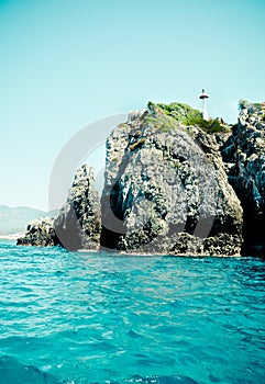 Aegean sea coast with small lighthouse