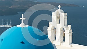 Aegean sea with view to Virgin Mary Catholic Church Three Bells of Fira, Santorini.