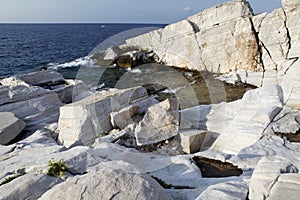 Aegean seashore and marble rocks in Aliki