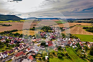 Aer ial view of a German village surrounded by meadows,