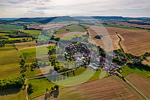 Aer ial view of a German village surrounded by meadows,