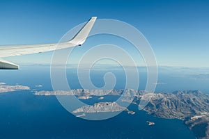 Aeral window shot of Greek Telendos and part of Kalymnos islands in Aegean sea