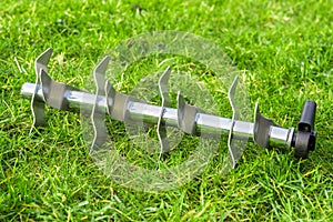 Aerating roller on the grass