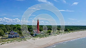Aereal Dron Shot Akmenrags Lighthouse on the Latvian Coast of the Baltic Sea photo
