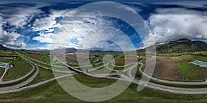 Aerial 360 Panorama of Highway, Farms and Mountain Landscape.